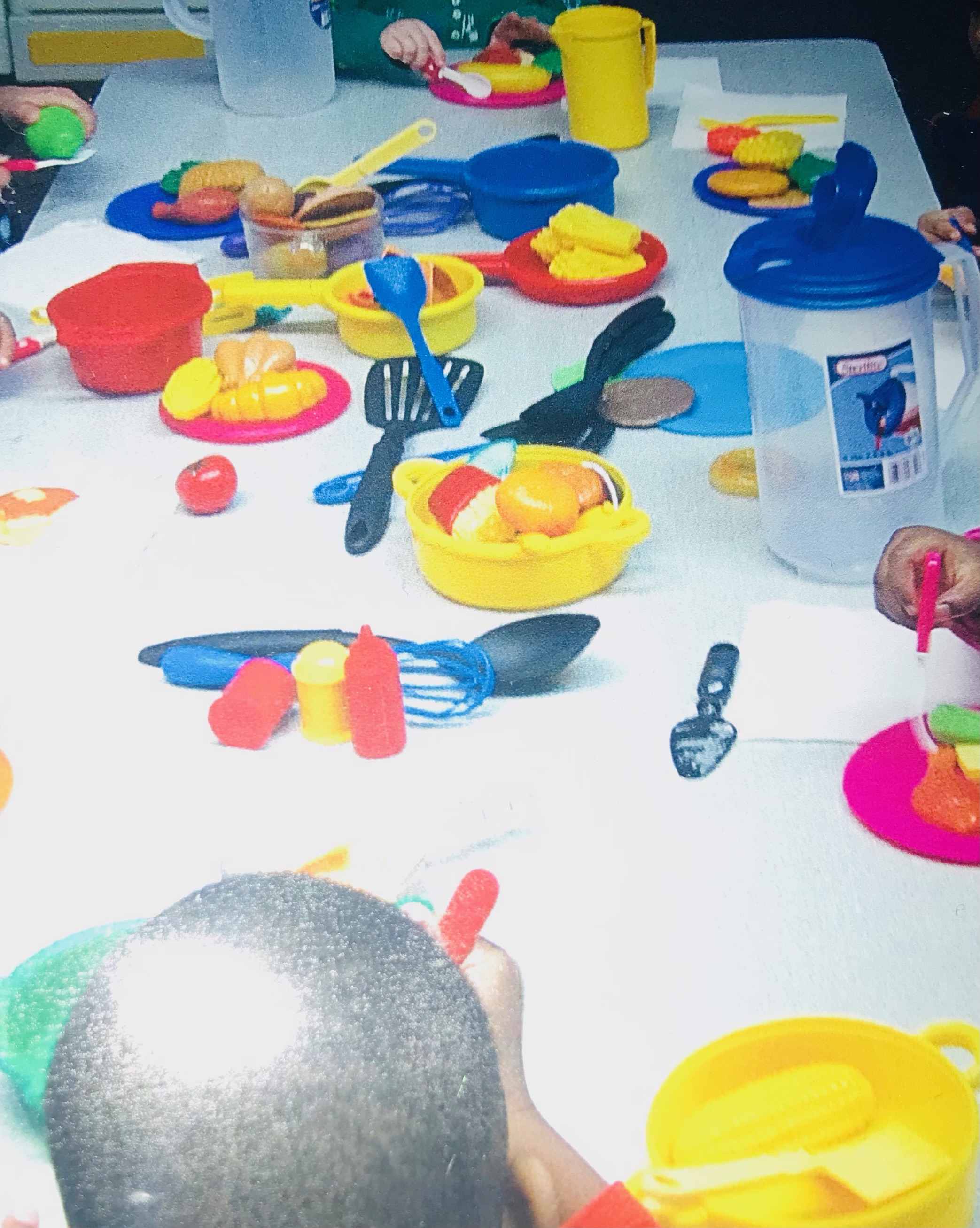 children playing with food toys